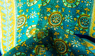 turquoise silk fabric with yellow drawings of flowers circles. Charmeuse has a beautiful drapery. This can be assembled in soft completeness. Texture