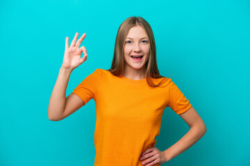 Fototapeta premium Young Russian woman isolated on blue background showing ok sign with fingers