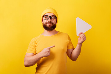 man pointing at play button sign over yellow background, technology, media player button