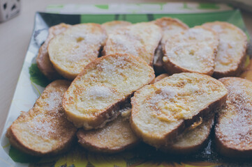 Toast fried in egg and sprinkled with sugar