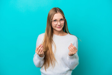 Fototapeta premium Young Russian woman isolated on blue background making money gesture but is ruined