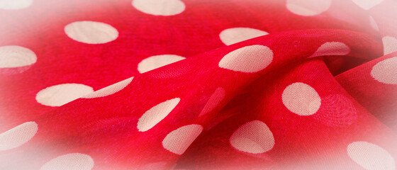 Background texture, decorative ornament, red polka dot fabric in white polka dots, round dots on...