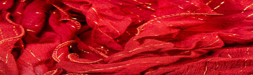 Red silk fabric with lurex. Glossy texture background, satin background, luxurious fabric, elegant...