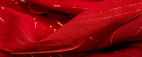Red silk fabric with lurex. Glossy texture background, satin background, luxurious fabric, elegant...