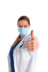 Portrait of young female doctor in medical mask looking at camera and showing thumb-up, isolated on white background. Satisfied doctor with white coat good results on studying virus, discover vaccine