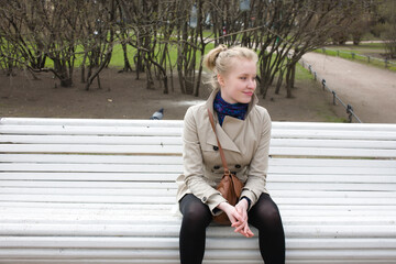 young pretty blonde girl enjoing spring nature in park, lifestyle people concept close up