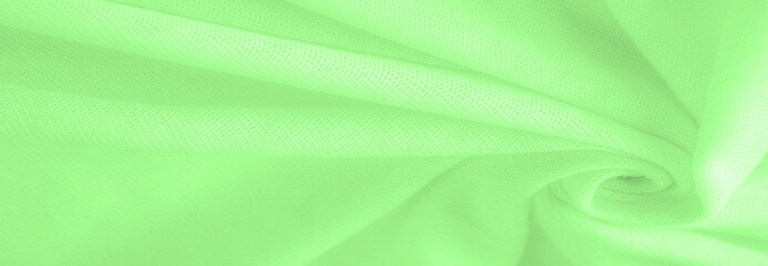 Green cloth. abstract background of luxury fabric or liquid silk