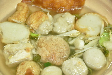 boiled Hakka meatball made from chop pork stuffing fried tofu with bean sprout and lettuce in soup on bowl