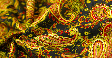 paisley pattern on dark black background. polyester cotton, this is an ornamental textile pattern using bote, a teardrop-shaped motif with a curved top end. Persian origin