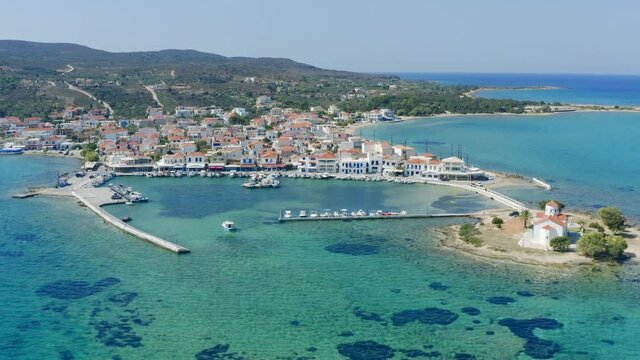 Elafonisos aerial drone view. Greek Island harbor buildings and Agios Spyridon church, Peloponnese Greece. 