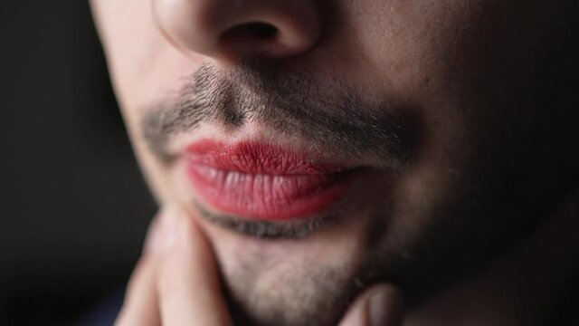 Closeup of a Queer Man With Red Lipstick and Beard