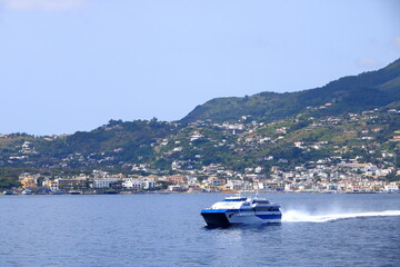 Fototapeta na wymiar view to Ischia Ponte village and the coastline from the boat