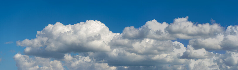 Naklejka na ściany i meble Designer Photography. Sky and clouds cumulus on a blue backgroun
