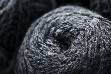 Tangles of gray yarn made of natural wool close-up