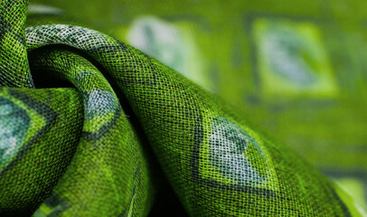 green silk fabric, delicate weaving, check print fantasy scarf, design, openwork weaving. Texture, background