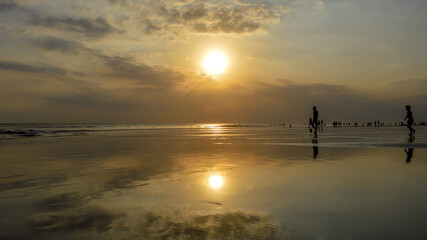 Magical Sunset colors in Bali Indonesia.  Sun reflecting in the sea, magical sun colors. Pure magic
