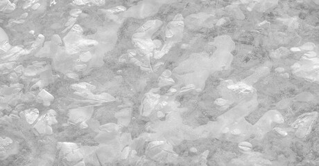 River ice: The presence of ice on rivers changes their behavior, hinders their use and causes serious economic problems. Full frame of textures formed by a block of cracked freezing water