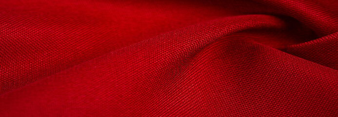 red silk fabric, this is silk satin weaving. Differs in density, smoothness and gloss of the front side, softness, Texture, background