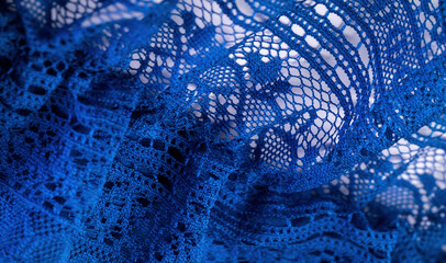 Background, texture, pattern, blue lace fabric, thin open fabric, usually made of cotton or silk, made using loops, twisting or knitting threads in patterns