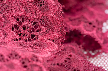 red lace. Elastic fashionable textile jacquard lace. Decorative item for sexy lingerie. elastic tapes. Home decor. Texture for your design. background. template.