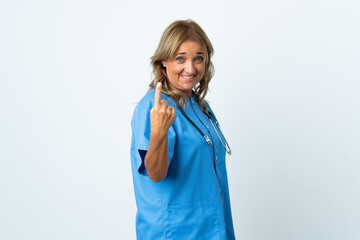 Middle aged surgeon woman over isolated background doing coming gesture