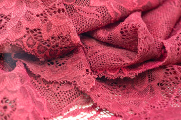 red lace. Elastic fashionable textile jacquard lace. Decorative item for sexy lingerie. elastic tapes. Home decor. Texture for your design. background. template.