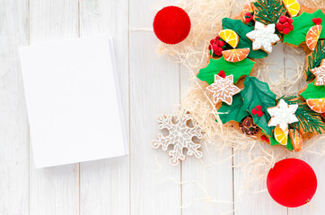 Christmas Concept. gingerbread in the form of a Christmas wreath lies on a white wooden background