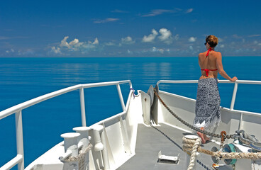 Woman looks out over Grand Bahama Banks Bahama Islands.