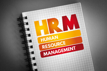 HRM - Human Resource Management acronym on notepad, business concept background - obrazy, fototapety, plakaty