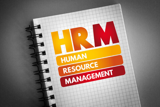 HRM - Human Resource Management acronym on notepad, business concept background