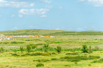 Fototapeta na wymiar steppe, prairie, veld, veldt - grassy plain in the temperate and subtropical zones of the northern and southern hemisphere. Plateau. Hills.