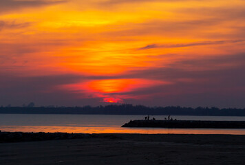 Sunset beach silhouette free styles in holiday ,water  sky and people.