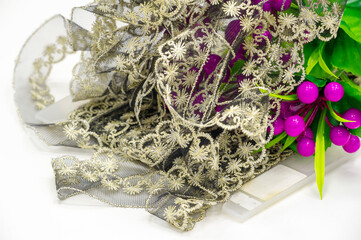 Vintage floral lace. Narrow lace trim. Decoration with a wedding ribbon. DIY app. Sewing Craft. Jewelry design creation