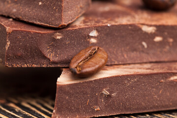 coffee and pieces of milk chocolate from cocoa