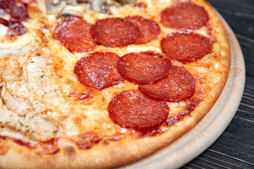 Top view of Pizza Margherita on black background. Classic Italian Pizza Margarita with Tomato sause, Basil and Mozzarella Cheese