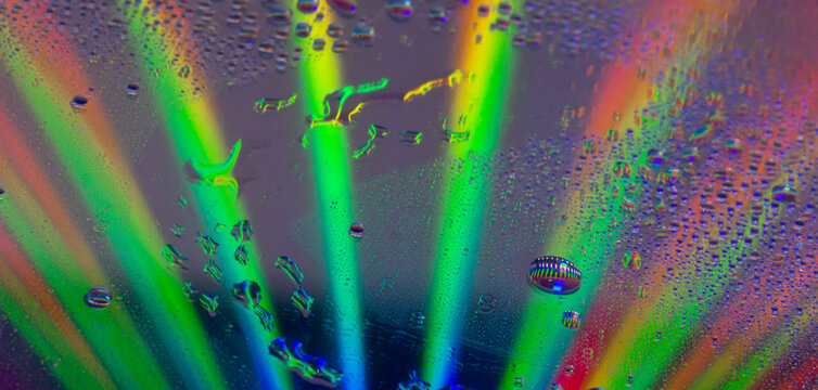colored light transitions and reflections from water droplets.. Background image