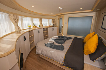Interior of large suite cabin on luxury yacht