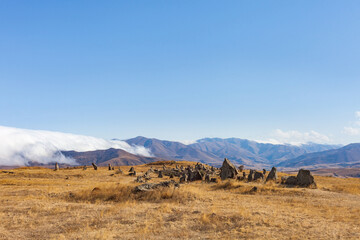 Standing stones in Zorats-Karer or Karahunj on a mountain plateau, Armenia.