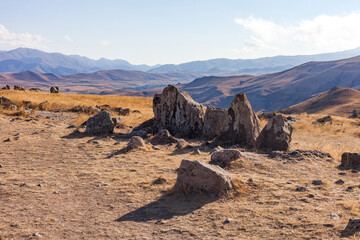 Standing stones in Zorats-Karer or Karahunj on a mountain plateau, Armenia.