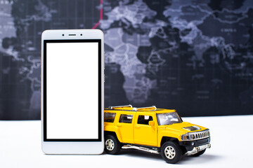 yellow car, smartphone and map