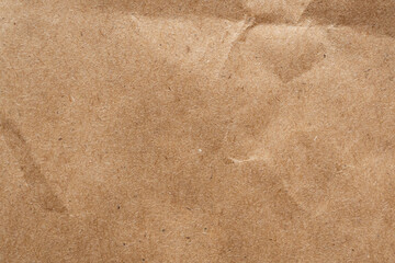 Brown crumpled paper recycled kraft sheet texture background