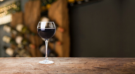 Empty dark wooden table in front of abstract blurred bokeh background of restaurant . can be used for display or montage your products.Mock up for space