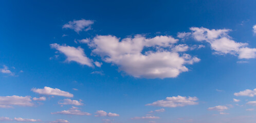 blue sky background with small clouds.