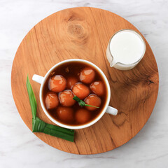 Kolak Biji Salak or Sweet Potato Porridge in White Bowl in White Background, Made from Sweet Potato, Sago Flour, Brown Sugar and Coconut Milk. It Made for Takjil or Dessert