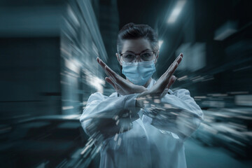 Doctor in a mask with a prohibiting hands gesture .