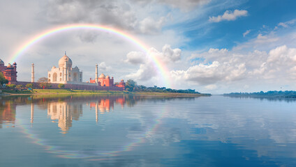 Panoramic view of Taj Mahal during bright blue sky reflected in water with rainbow - Agra , Uttar...
