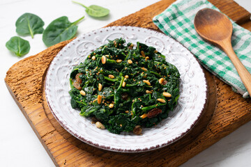 Spinach with pine nuts and raisins. Traditional Catalan recipe. Typical dish of Barcelona.