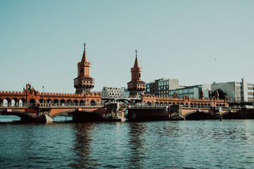 Oberbaum Bridge is a double-deck bridge crossing over river Spree, which connects districts Kreuzberg and Friedrichshain