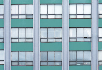 Green colored architecture building with windows.