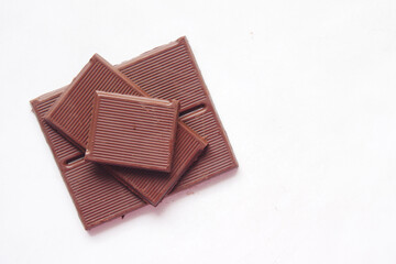 dark chocolate on a plate on white background 
